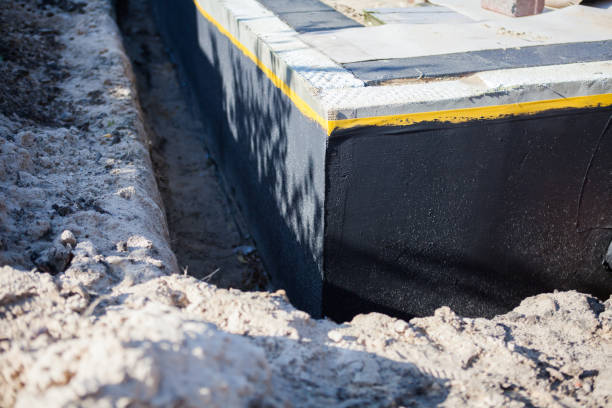Professional Waterproofing technician working in Lima, NY